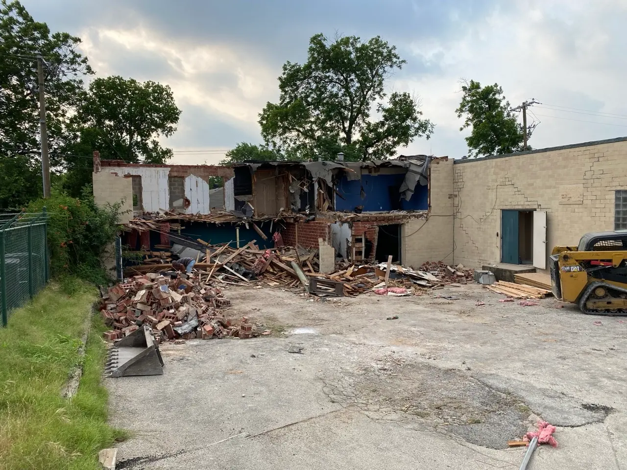 The back of the old building comes down to make room for what comes next.