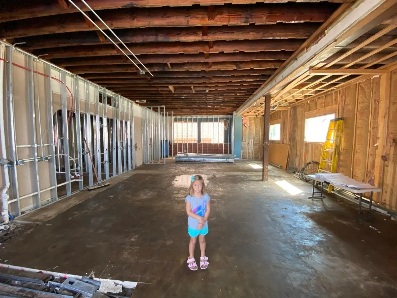 The first floor, down to concrete and studs.