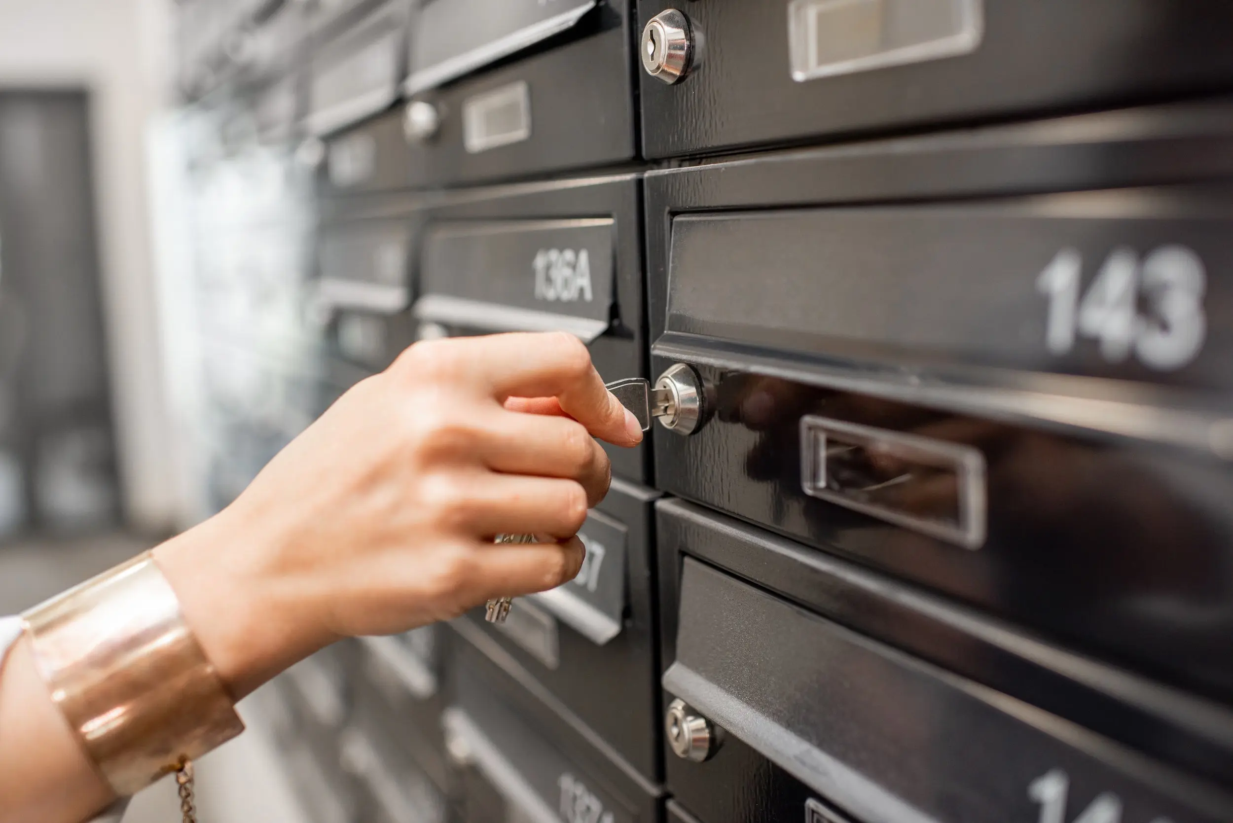 A member opening a business mailbox