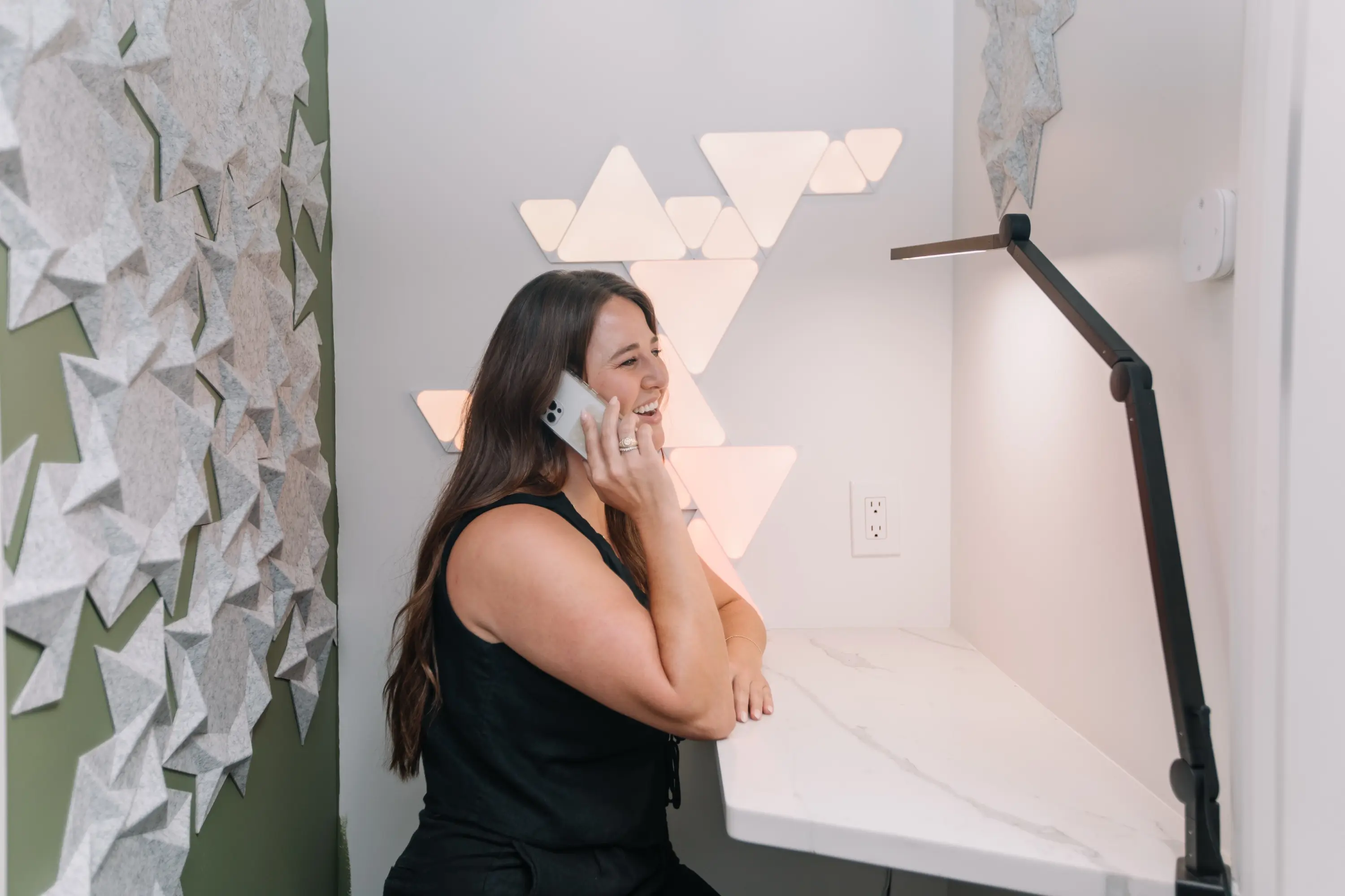 A member taking a call in the phone booth